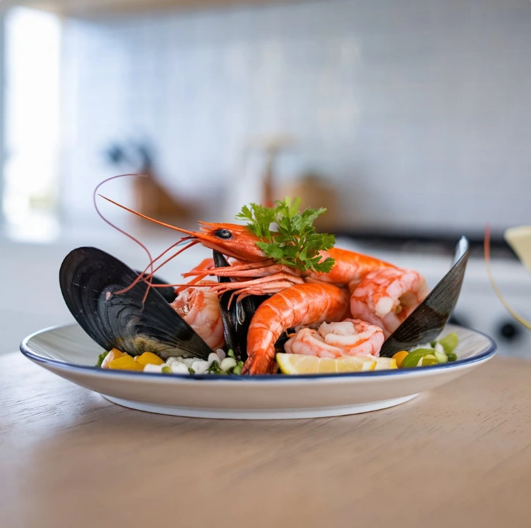 Seafood boil with shrimp, crab, corn, and potatoes spread on a table